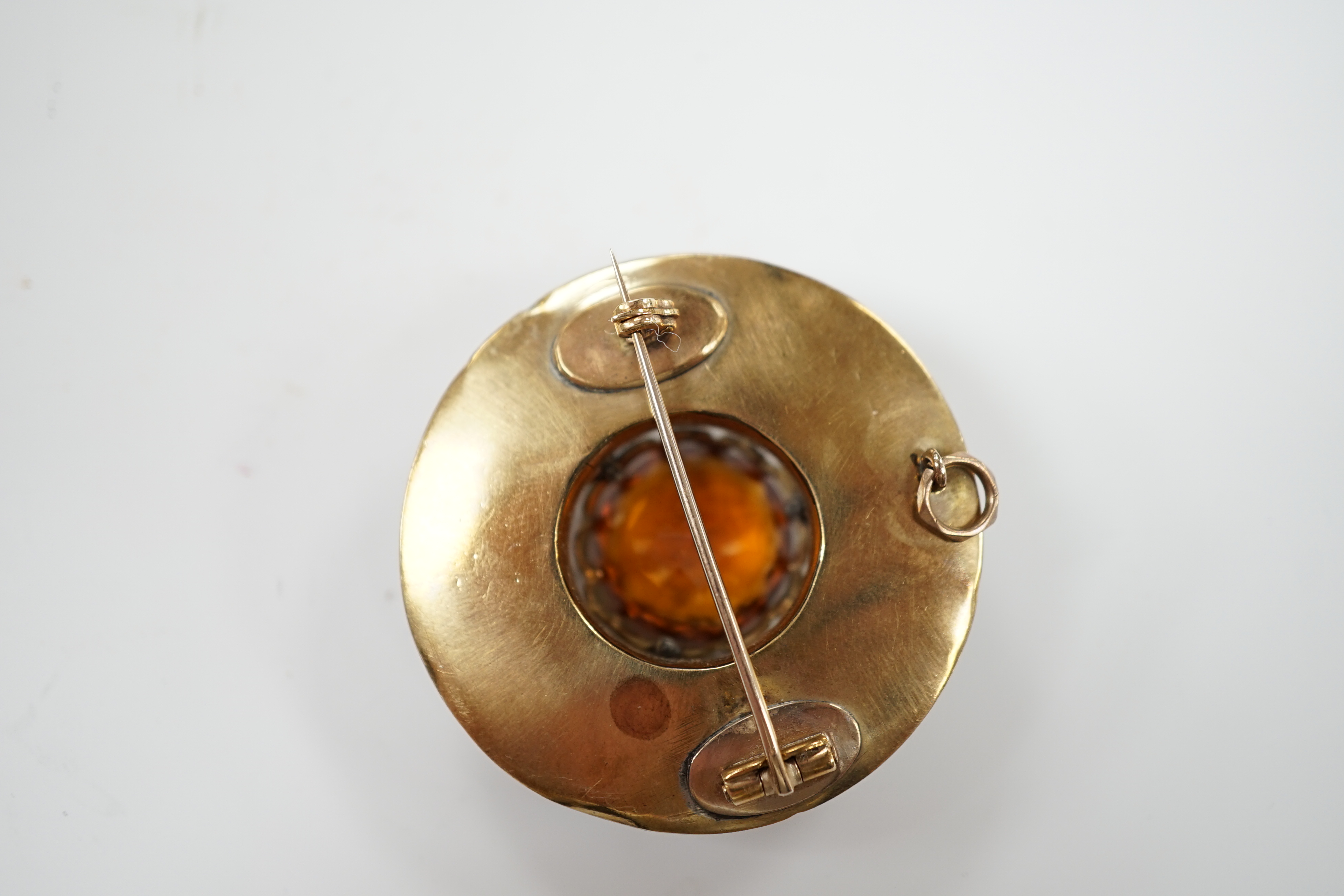 A Scottish yellow metal, citrine and Scottish hardstone set circular brooch, 41mm.